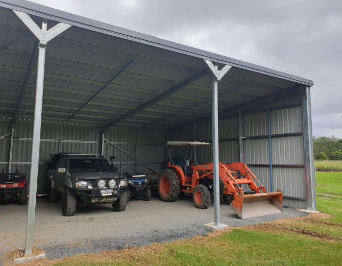 Barn With Farm Equipment — Natural Sheds and Shelters in Coffs Harbour, NSW